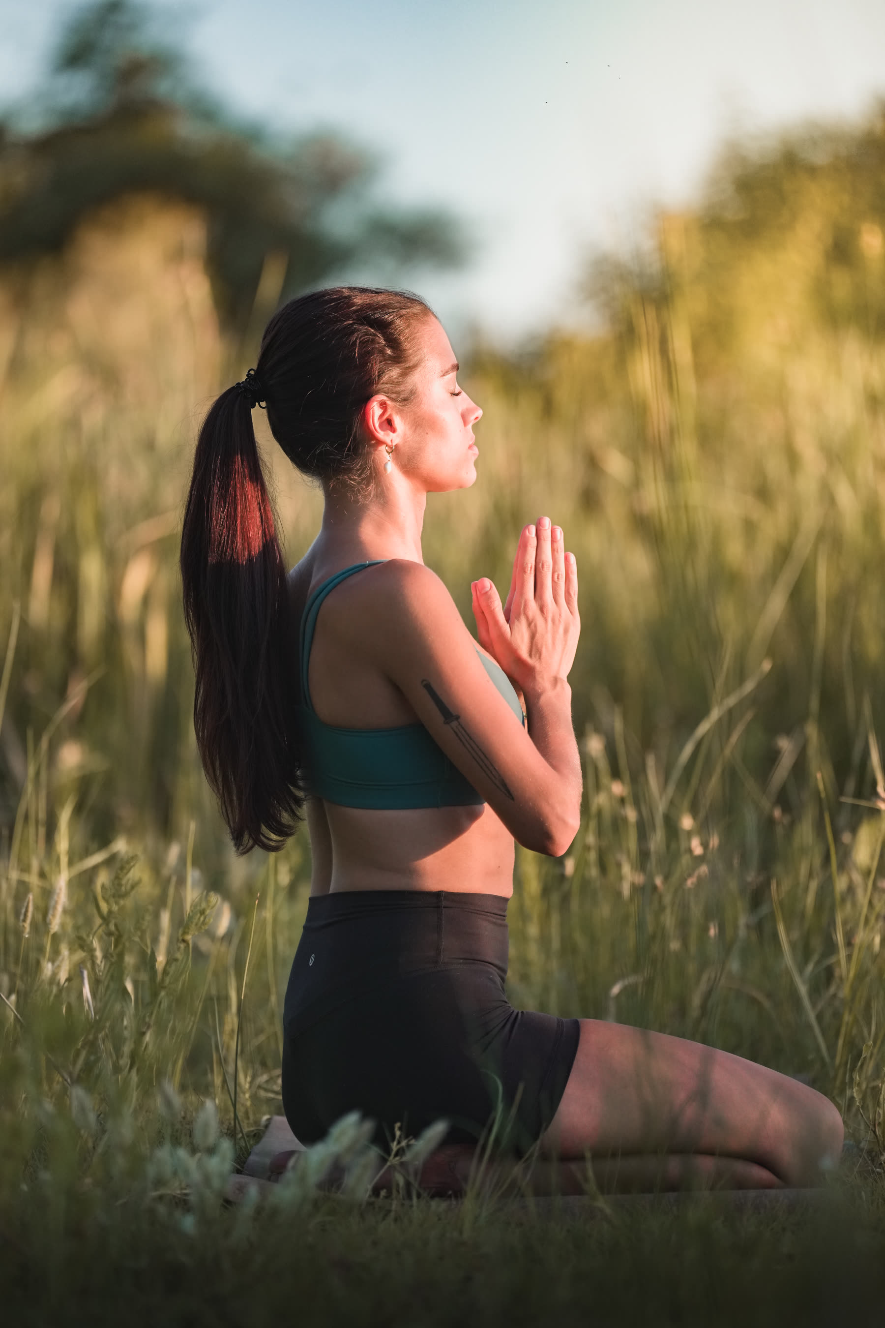 Editorial yoga shoot, kneeling pose in profile