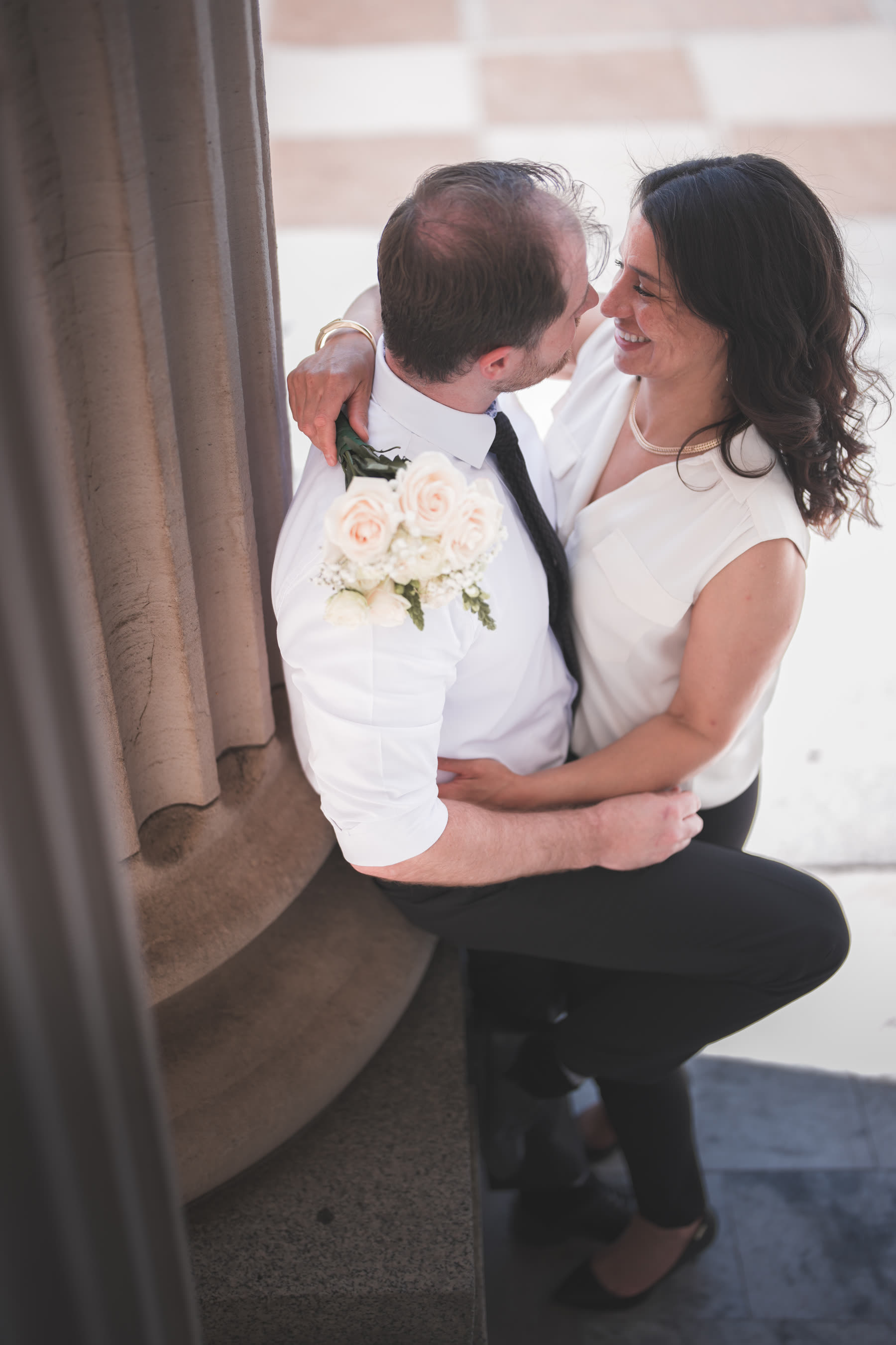 Couple laughing together on their wedding day
